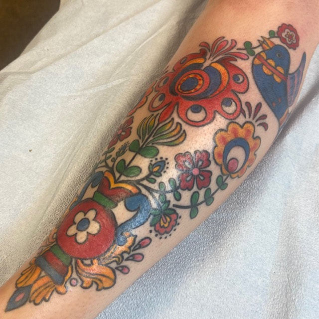Kurbits tattoo on the forearm.